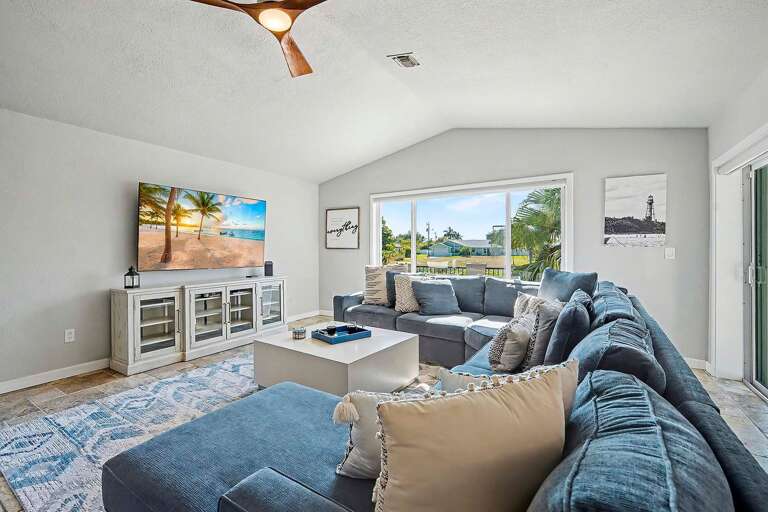 Large Comfortable Living Room with Comfortable Couch, Smart TV and Lots of Space to Relax