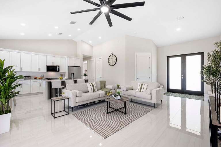 Living Room with Open Layout to Kitchen and Dining Space