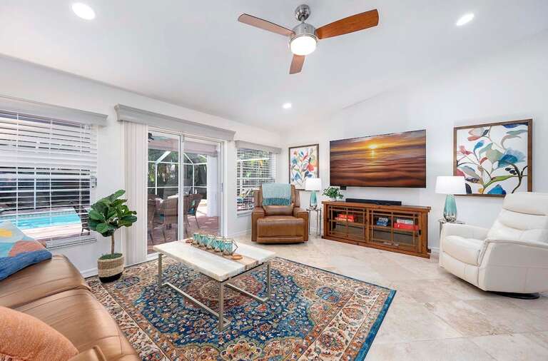 Living Room with Access to Pool Area and Flat Screen TV