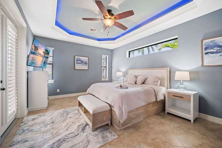 Main King Bedroom with TV and Access to the Pool/Lanai