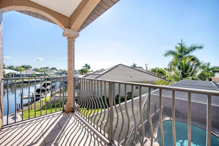 Small Balcony Facing the Pool and Canal connected to Queen Bedroom