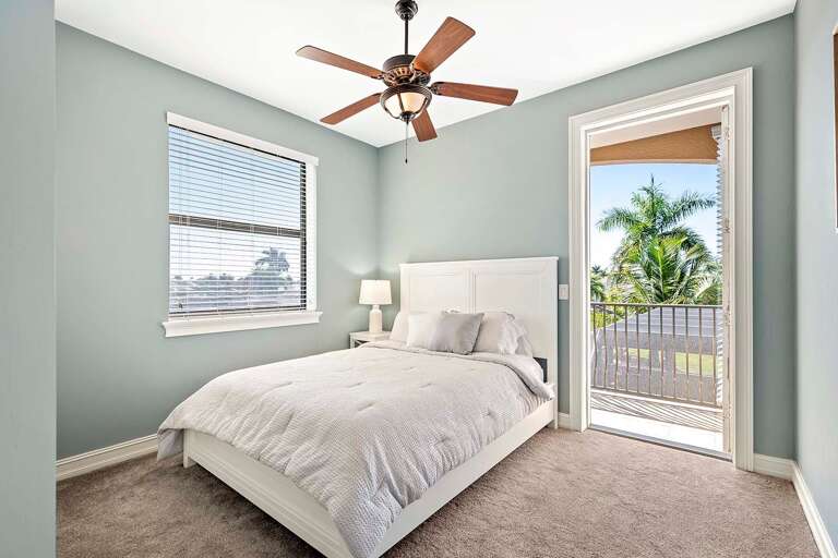 Upstairs Queen Guest Bedroom with attached small Balcony