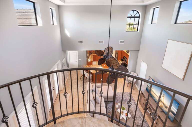 View from the Indoor Upstairs Balcony of the Living Room and Kitchen