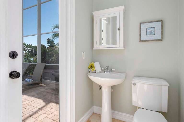 Half Bath Connected to Kitchen and Pool Area