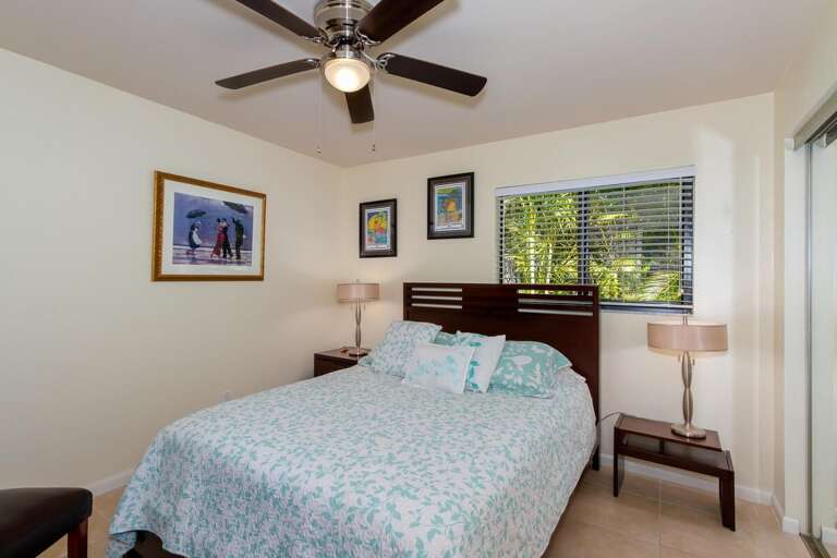 Guest bedroom 2 with a queen size bed, dresser and two night stands