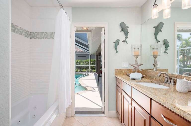 Guest Bathroom with Pool Access and Shower/Tub Combo