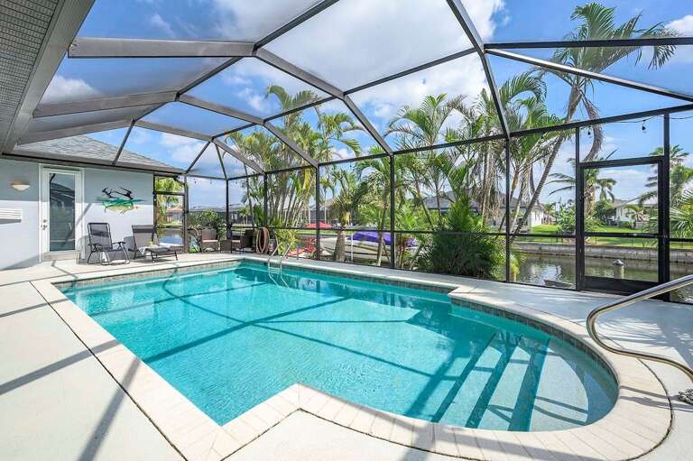 Tropical and Lush Landscape Surrounding the Pool Area