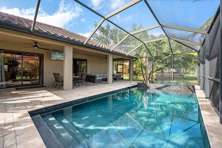 Enjoy a Large Pool with Spa Surrounded by Tropical Palms and Lush Landscape with Lots of Privacy
