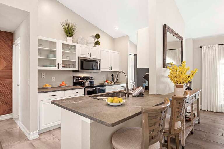 Kitchen with Bar and View of the Main Living Space