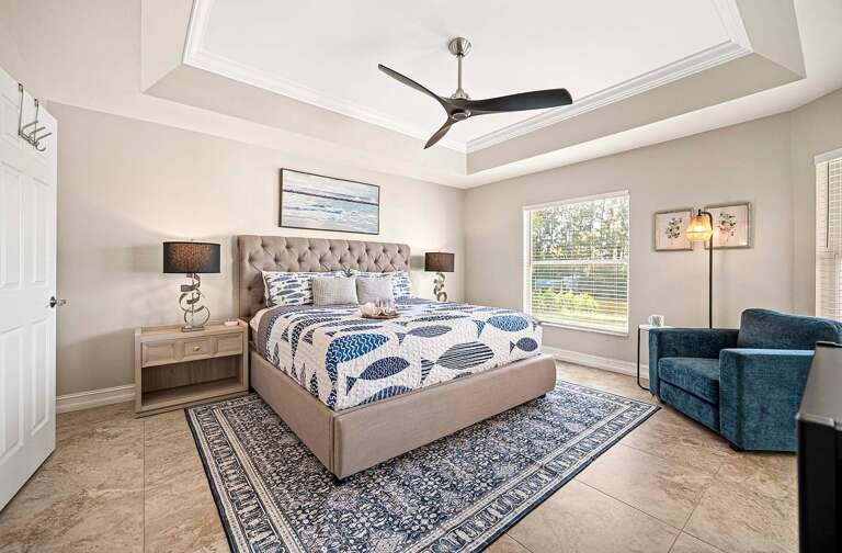 Main King Bedroom Suite with view of the Lanai and Pool