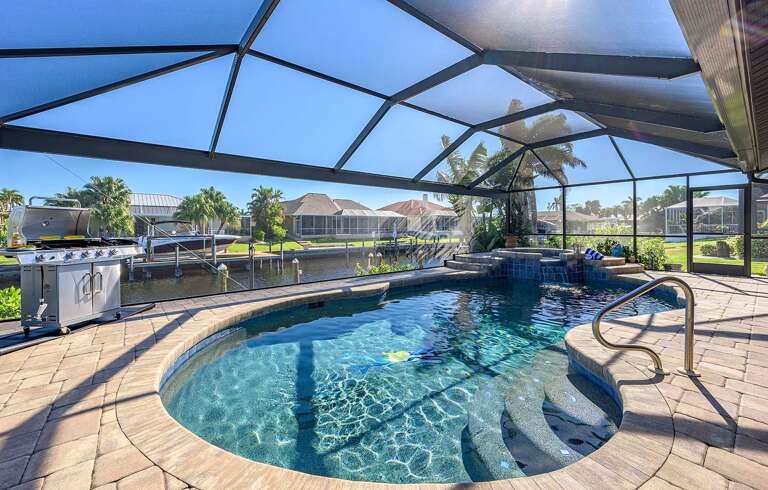 Beautiful Eastern Facing Pool with Waterfall Spill over Spa