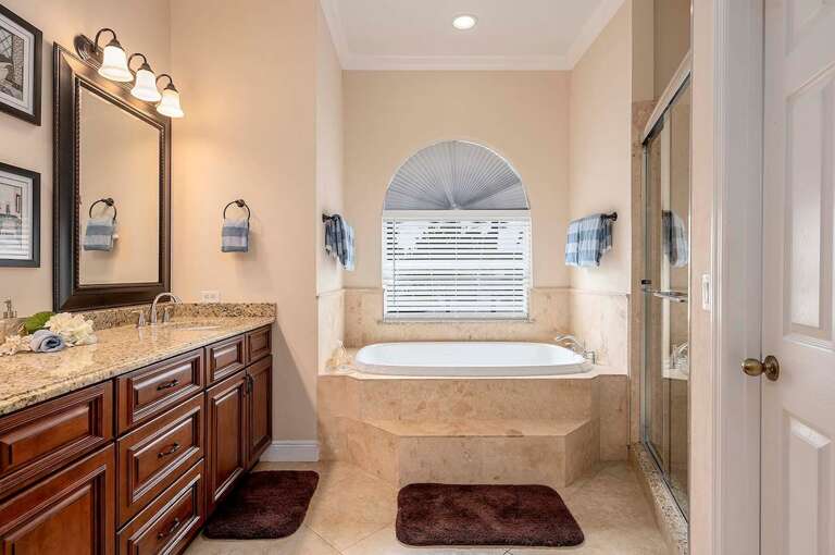 Main Bathroom with Dual Sinks and Garden Tub