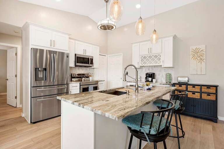 Kitchen with Stainless Appliances and Additional Seating at the Island