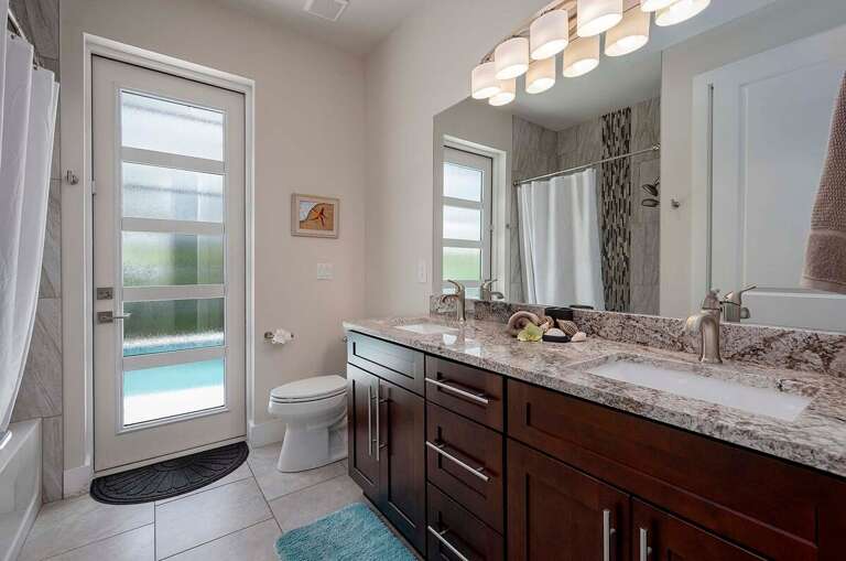 Double Sinks and Shower Tub Combo for Guest Bathroom with Pool Access