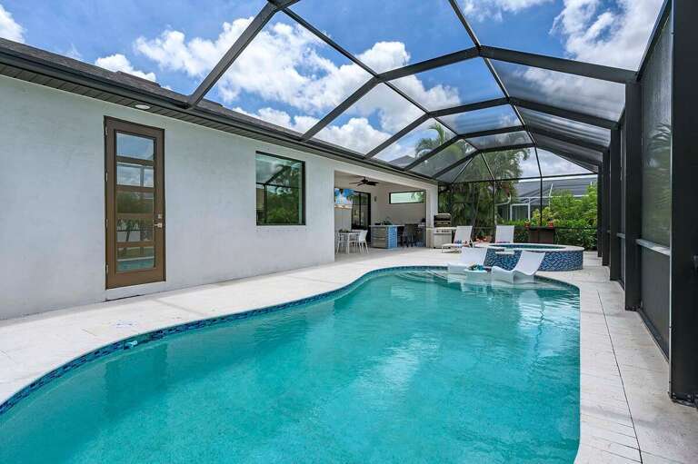 Outdoor Pool Space Surrounded by Tropical Landscape