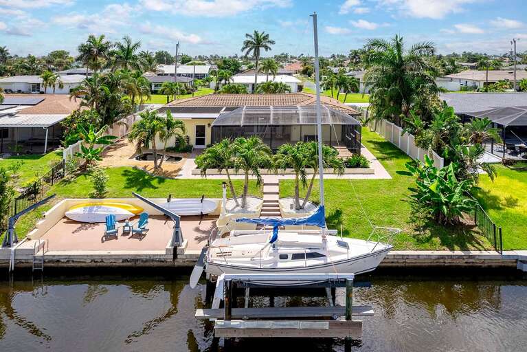 Aerial View of Backyard with Dock and Sitting Area