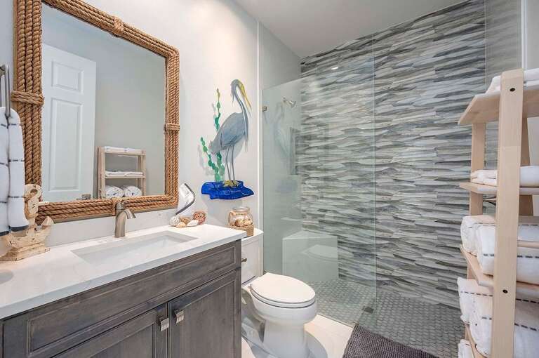 Hallway Bathroom with Walk in Shower and Pool Access