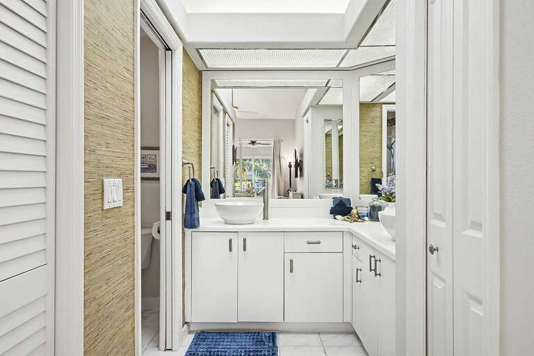 En-Suite Bathroom with His and Hers Sinks and Separate Shower