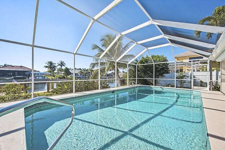 Enjoy a Cool Dip and Views of the Canal with Boats Passing by.
