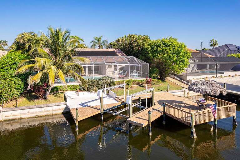 Extended Boat Dock and Tiki Hut to Enjoy the Passing By Boats and Parking Space for your Boat Rental