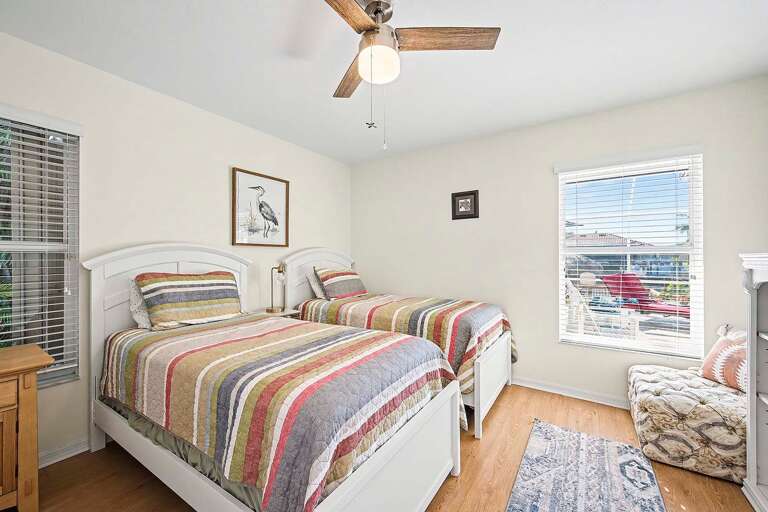 Guest Bedroom with Twin Beds and Views of the Pool Area