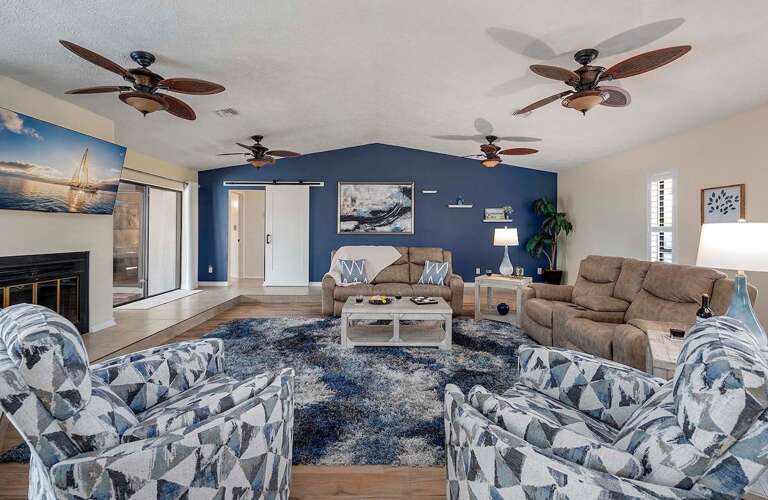 Sunken Living Room with Reclining Couches and Reclining Chairs
