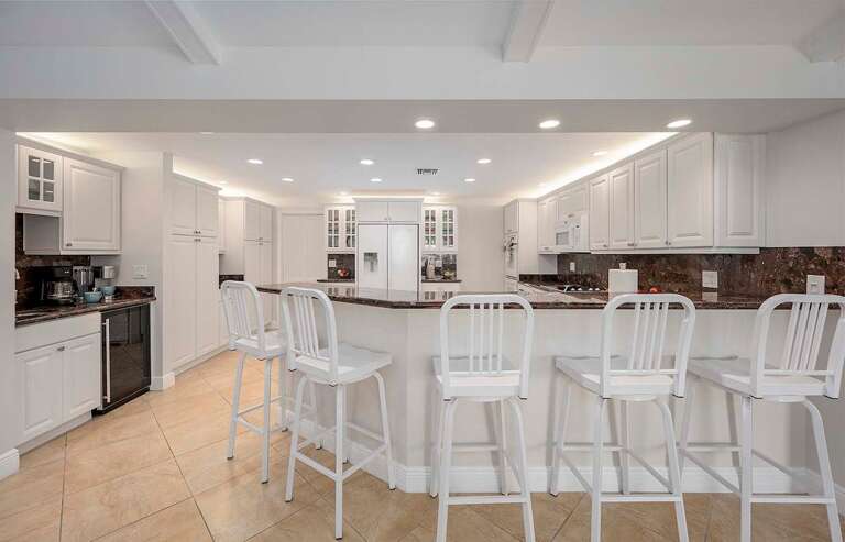 Additional Seating Space at Kitchen Bar Counters and Double Ovens