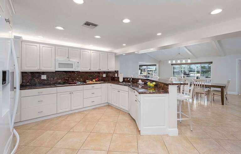 Large Kitchen with Views of Dining Space and Pool