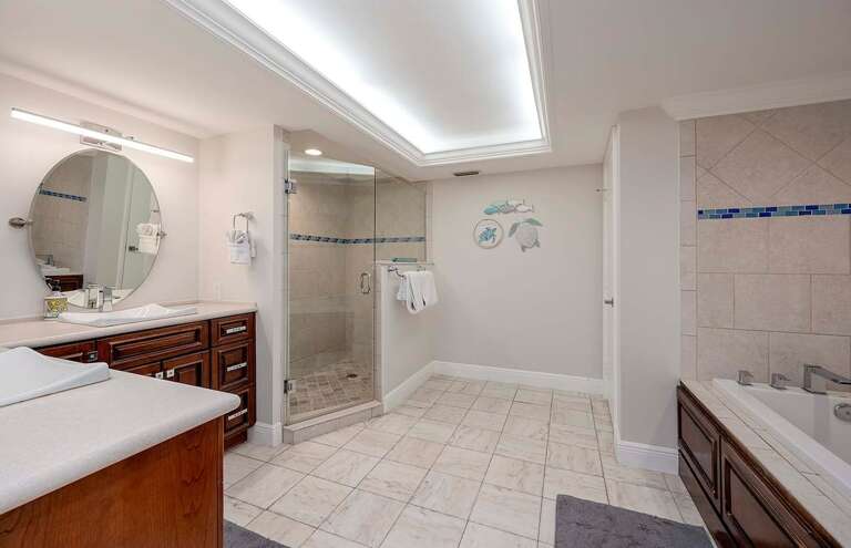 Main Bathroom Connected to King Bedroom with Garden Tub and Dual Sinks as well as Shower