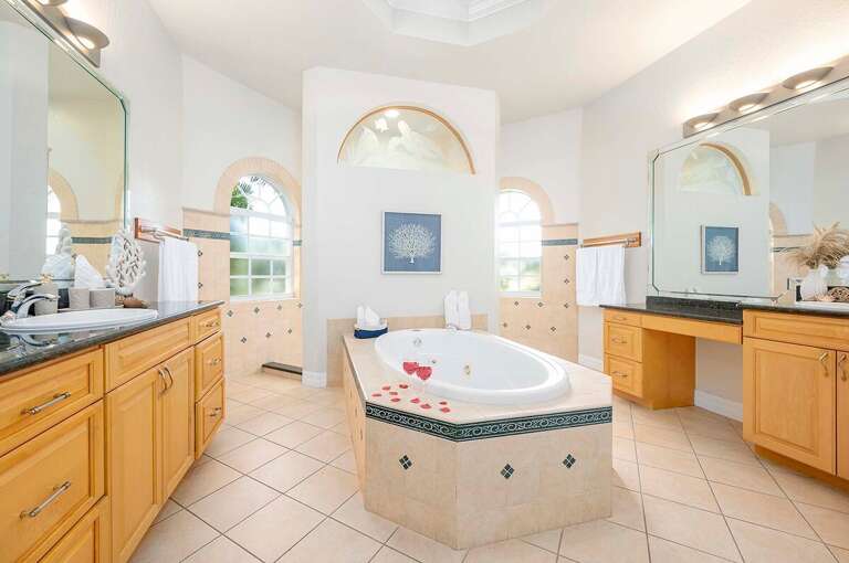 Main Bathroom with Wrap Around Shower and Two Sink Areas