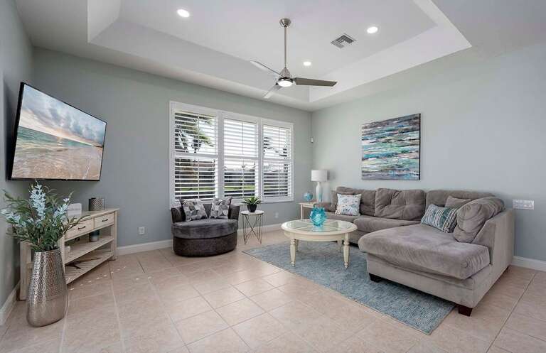 Living Room with Comfortable Couch and Swivel Chair