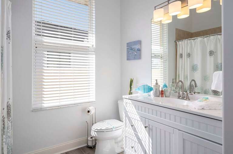 Shower/Tub Bathroom Connected to Hallway as well as Secondary King Bedroom