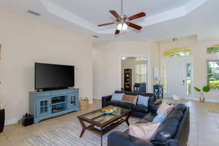 Living Room with TV and View of the Pool/Patio