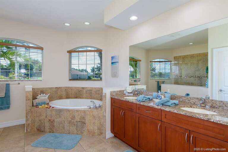 The Master Bathroom with Dual Sinks, Soaking Tub and Walk in Shower
