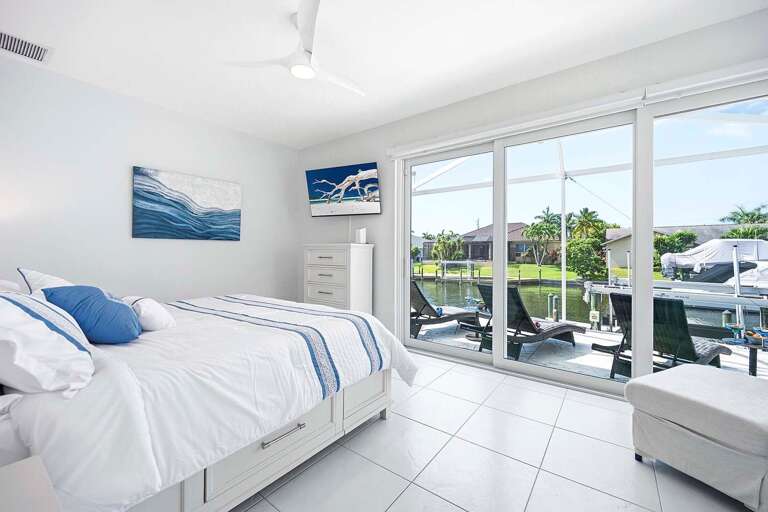 Guest King Bedroom with View and Access to the Patio, Sitting Area and TV