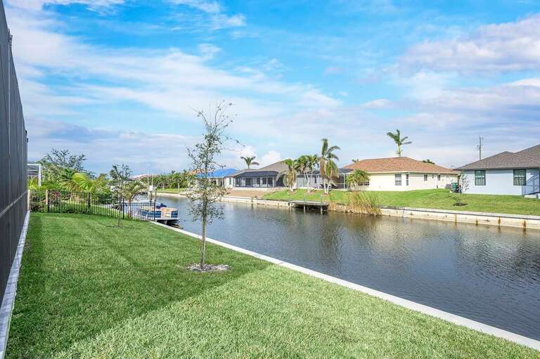 Outdoor Yard Area with Access to Canal for Fishing