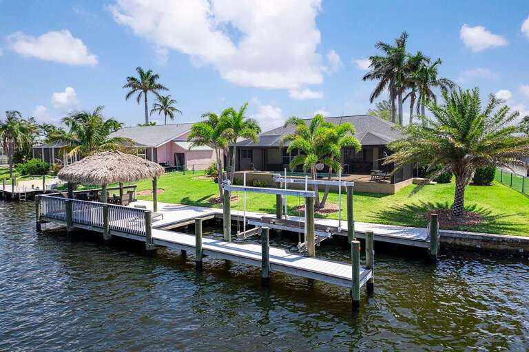 Enjoy an Extension of the Lanai with Tiki Hut and Sun Deck as well as Boat Slip and Lift