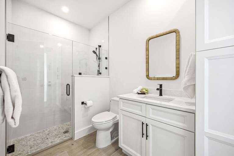 En-Suite Bathroom to Queen Bedroom and with Access to the Pool/Lanai