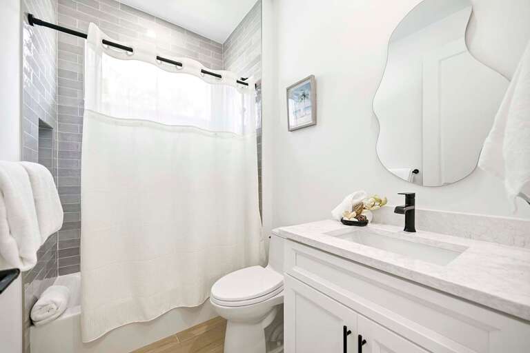 Hallway Bathroom with Shower Tub Combo and Sink