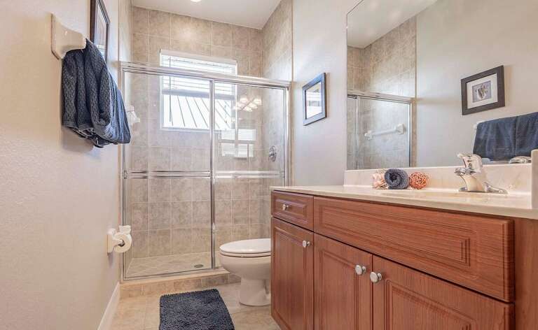Guest Bathroom with Walk in Shower located in Hallway between the Queen and Twin Bedroom