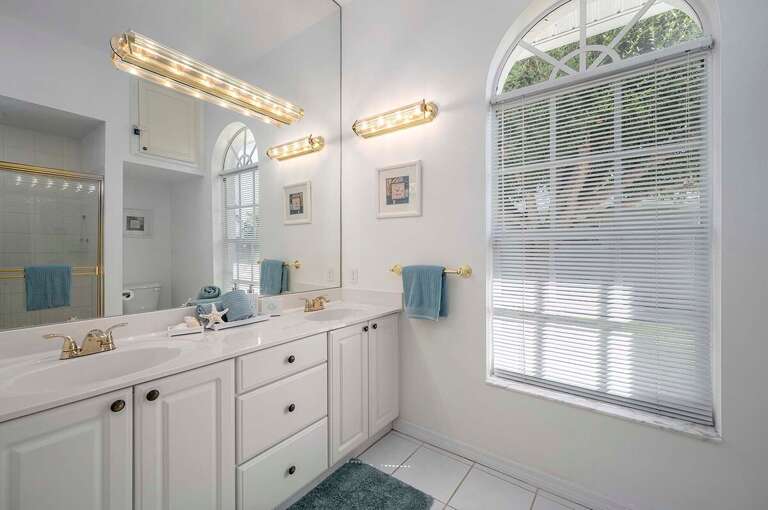Guest Bathroom with Double Sinks and a Shower