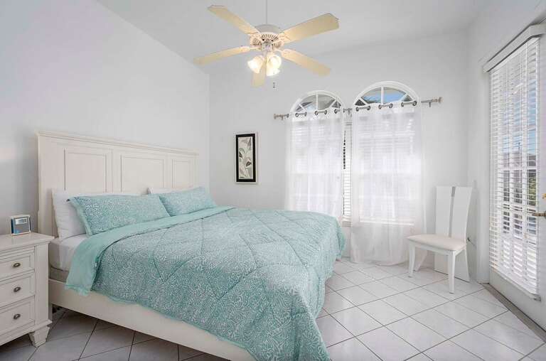 Guest King Bedroom with French Door Access to the Lanai and Pool