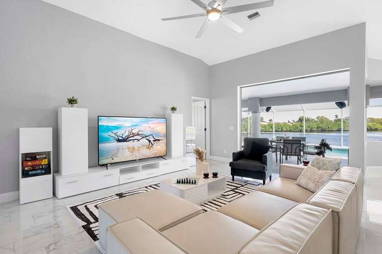 Open Living Room with Fantastic Views of the Lanai and Pool