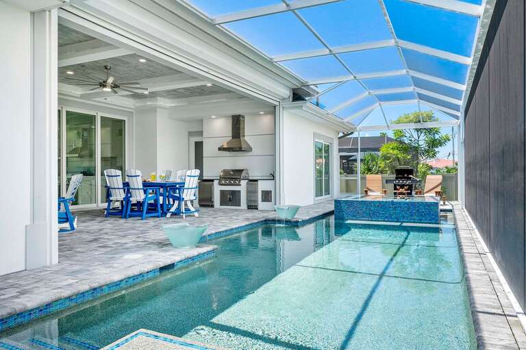 Covered Lanai for Great Outdoor Entertainment.
Lounge Space and Dining Space with Gas Fire Place and TV