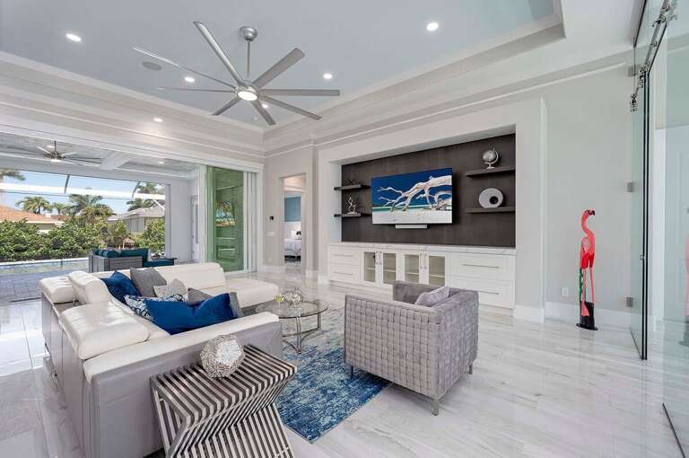 Open Living Room With Views of the Garden and Pool