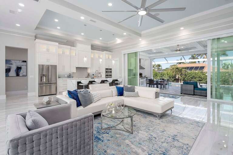 Villa Rosegarden features an Open Floor Plan where Entertainment Floats from the Living Room to Kitchen to Outdoor
