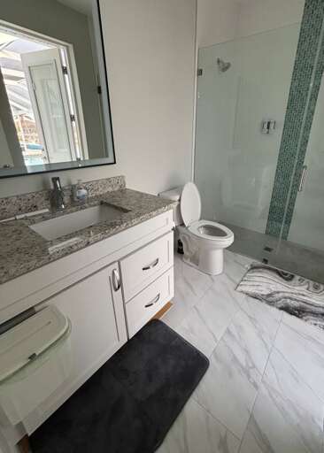 Guest Bathroom En-Suite to Queen Bedroom with Access to Lanai/Pool