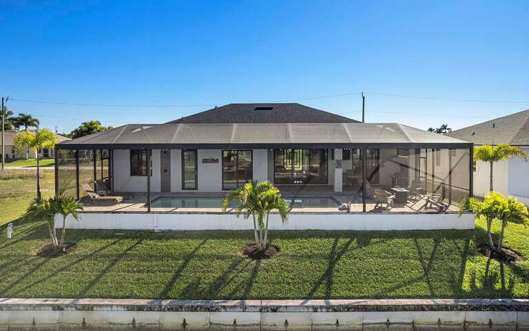 Aerial Rear View of Salty Sunshine Getaway Great for Fishing of the Seawall