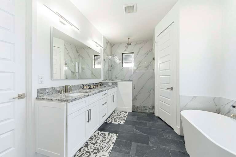 En-Suite Bedroom Suite with Walk in Shower and Tub.