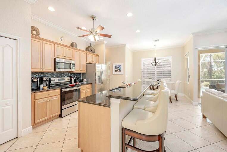 Kitchen with Bar Counters and Additional Seating